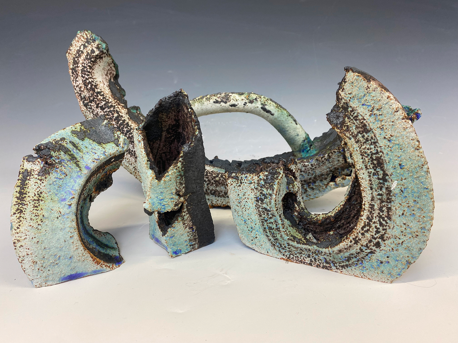 Dark purple organic ceramic form.